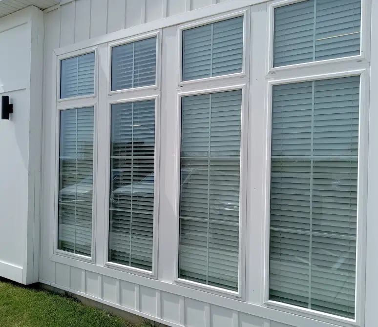 White-framed windows with blinds