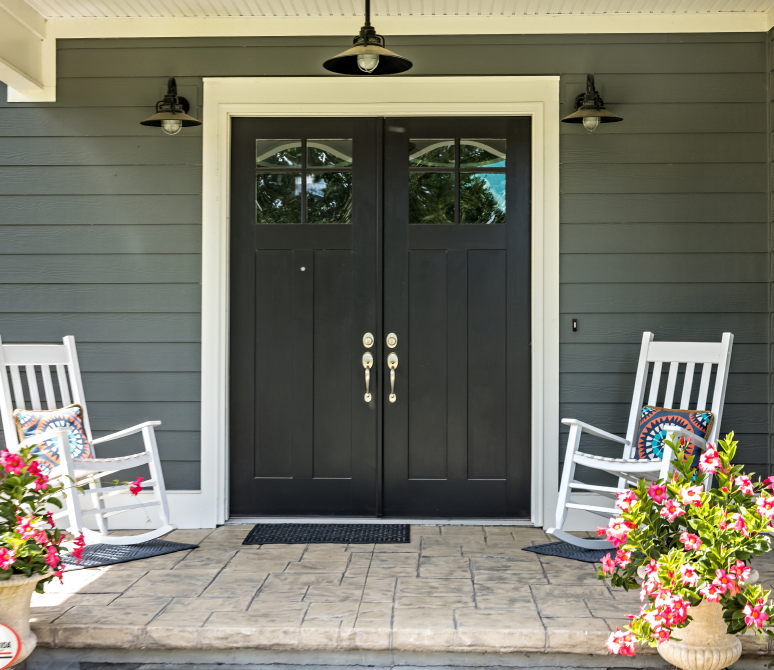 Rocking chairs and flowers on porch