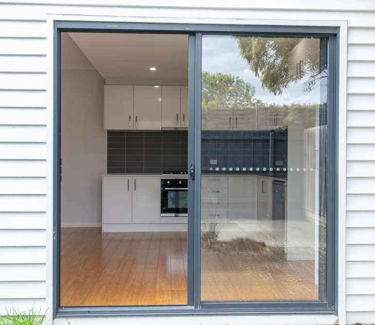 View of kitchen through glass door